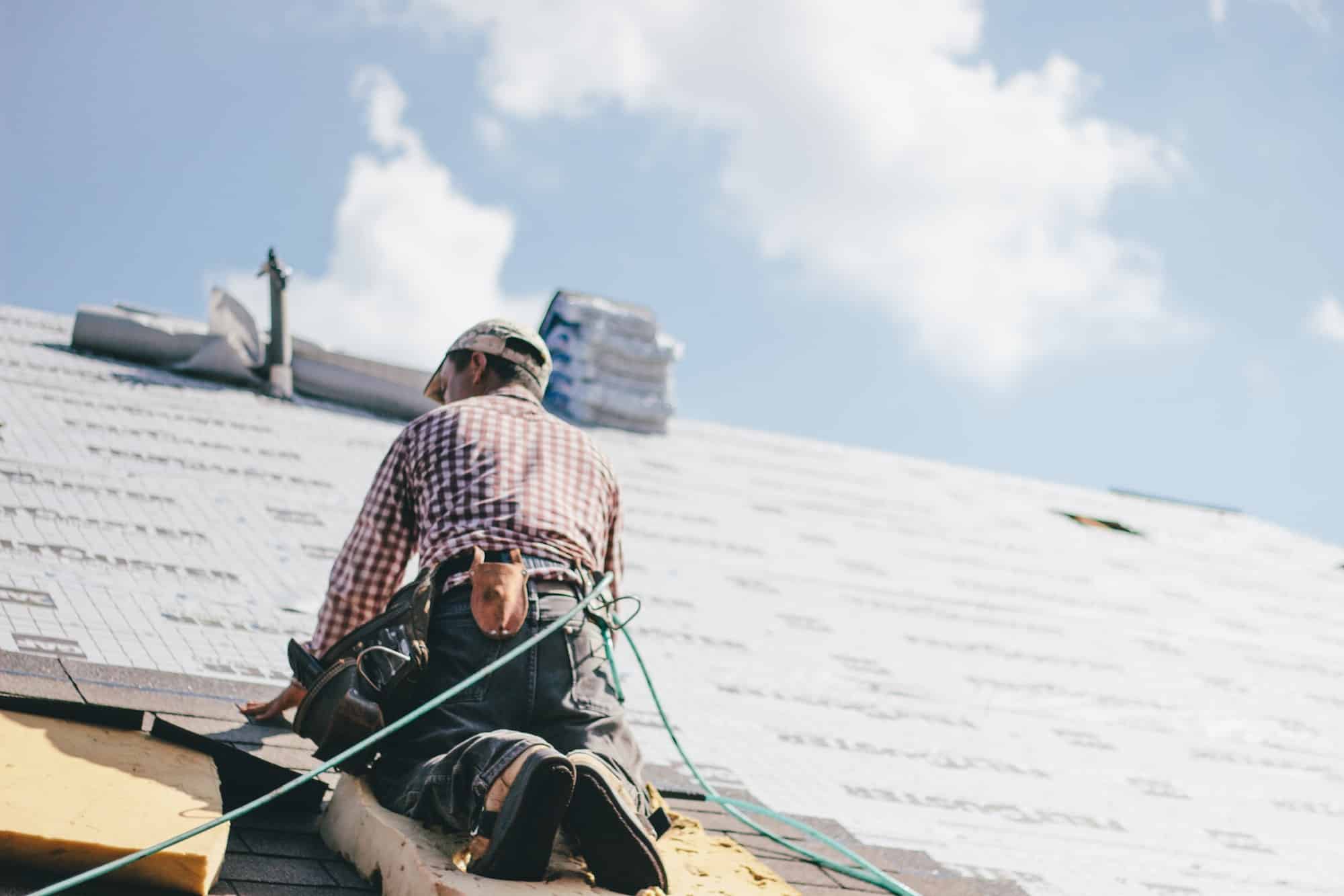 roofer-adding-shingles-to-the-roof-of-a-house.jpg